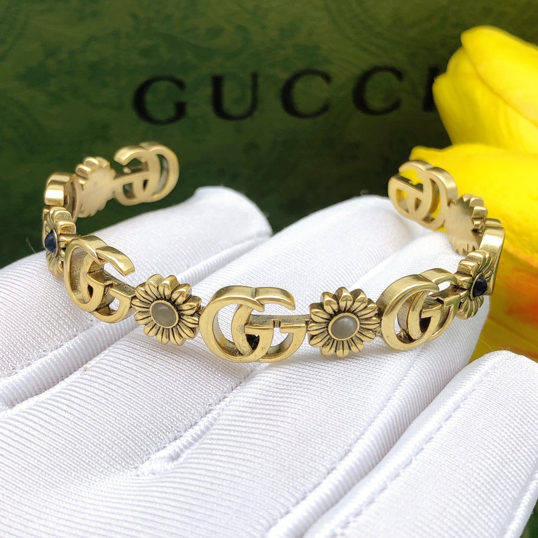 Gucci Interlocking G Antique Gold-Tone Sunflower Bangle - album image 6