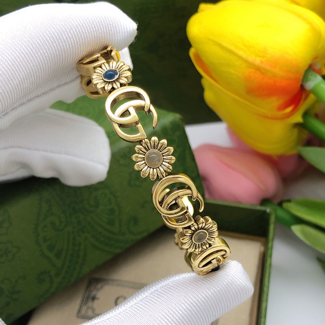Gucci Interlocking G Antique Gold-Tone Sunflower Bangle - album image 3