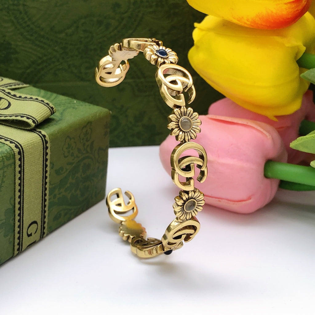 Gucci Interlocking G Antique Gold-Tone Sunflower Bangle - album image 1