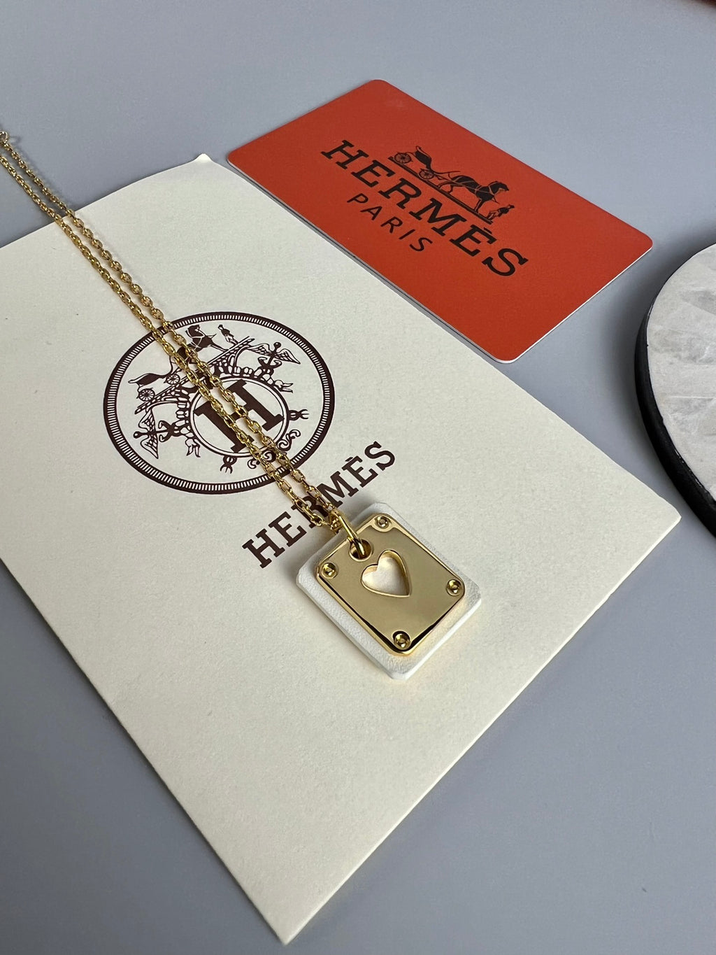 Hermès Silver-Tone Round H Tag Pendant Necklace - album image 1