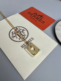 Hermès Silver-Tone Round H Tag Pendant Necklace - album image 1