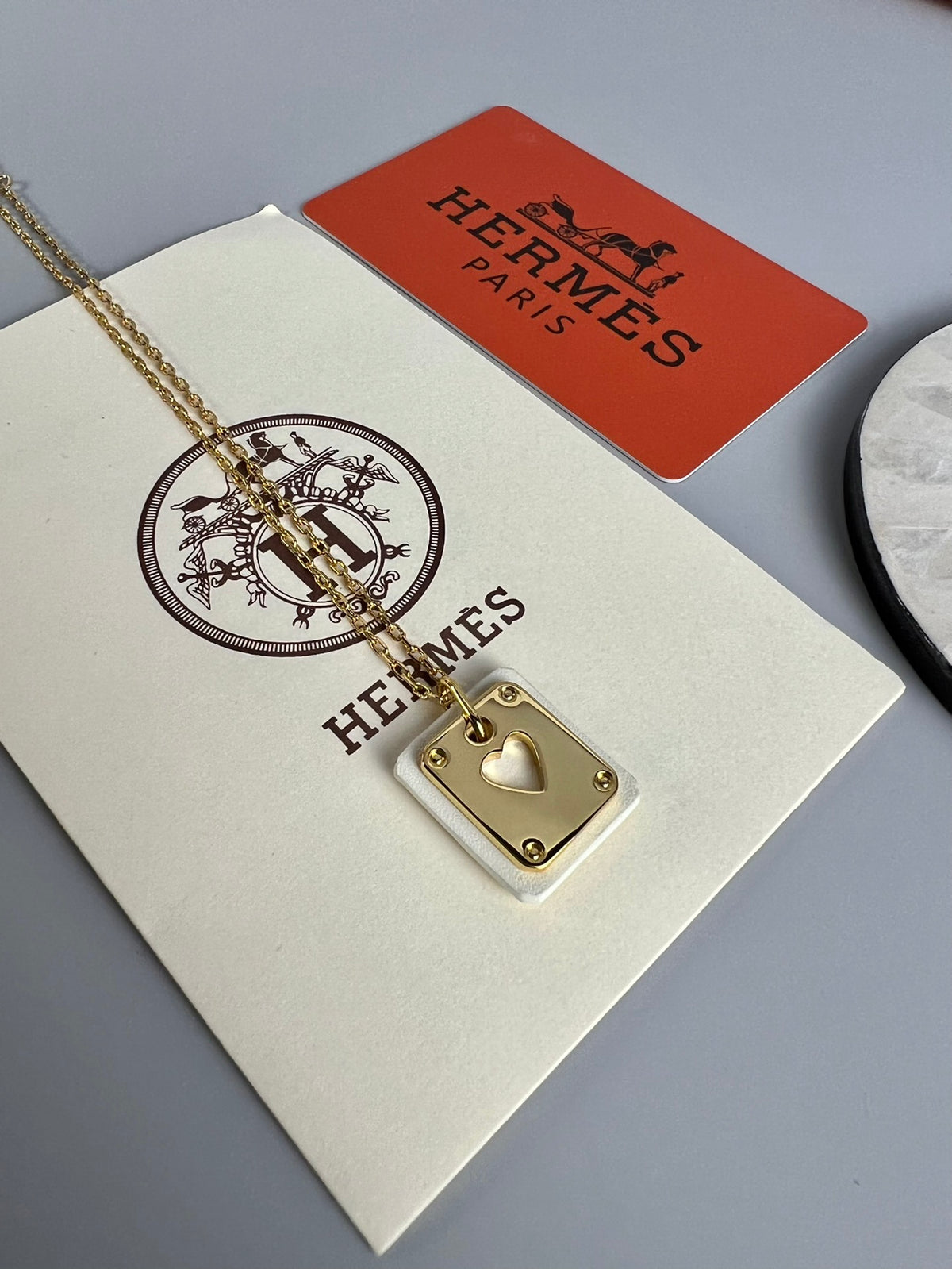 Hermès Silver-Tone Round H Tag Pendant Necklace - album image 1