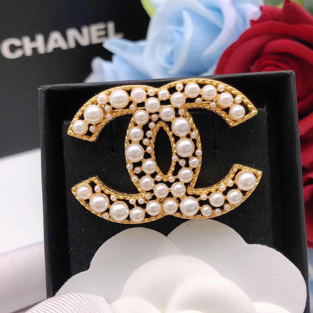 Chanel Interlocking C Pearl Brooch - album image 1