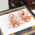 Dior Rose-Gold-Tone Letter Pearl-Look Earrings - product image 1