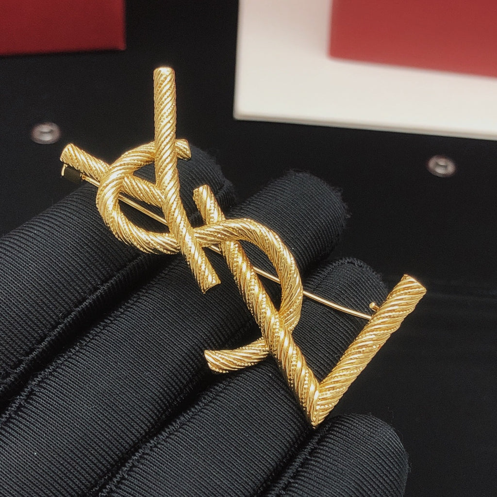 Saint Laurent Gold-Tone Textured Monogram Brooch - album image 3
