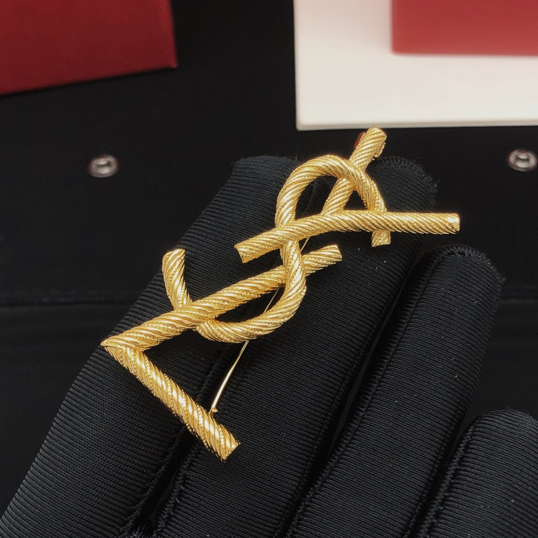 Saint Laurent Gold-Tone Textured Monogram Brooch - album image 2