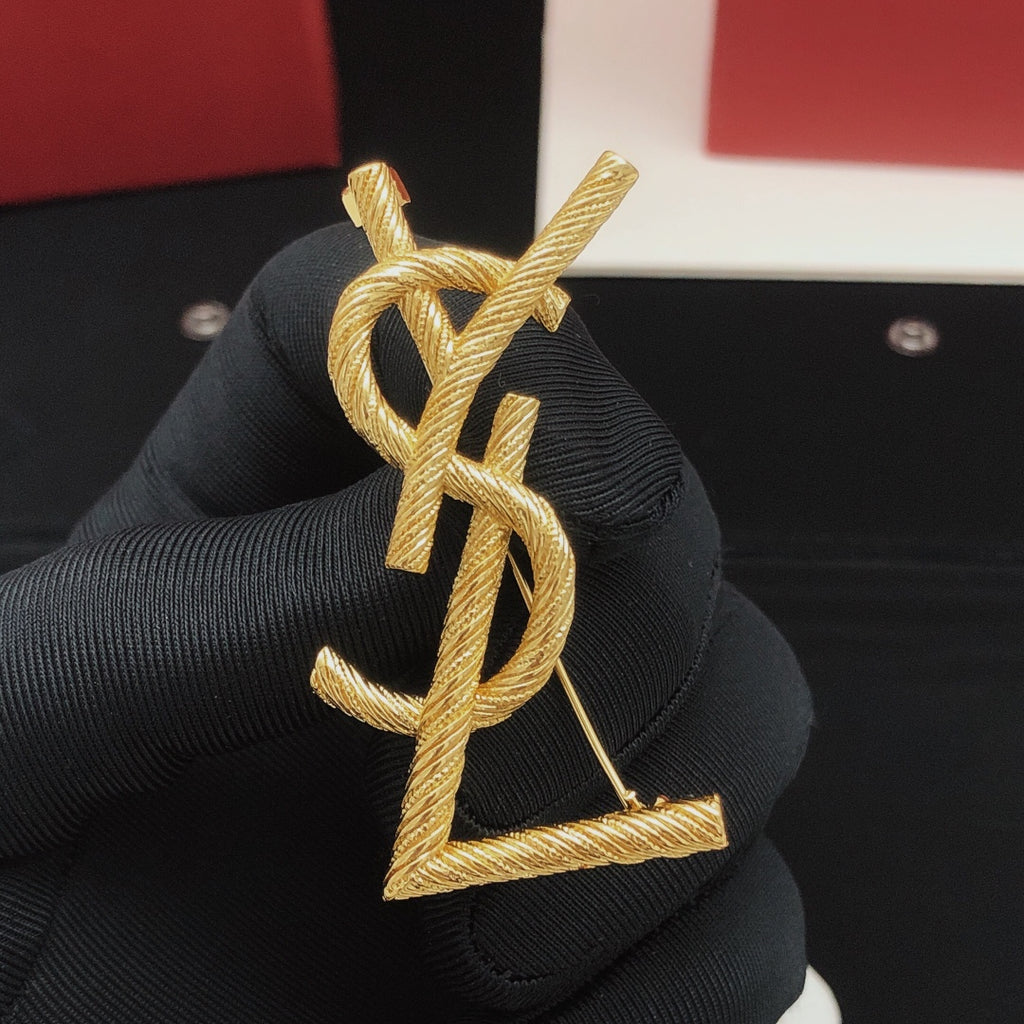 Saint Laurent Gold-Tone Textured Monogram Brooch - album image 1