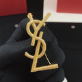 Saint Laurent Gold-Tone Textured Monogram Brooch - album image 1