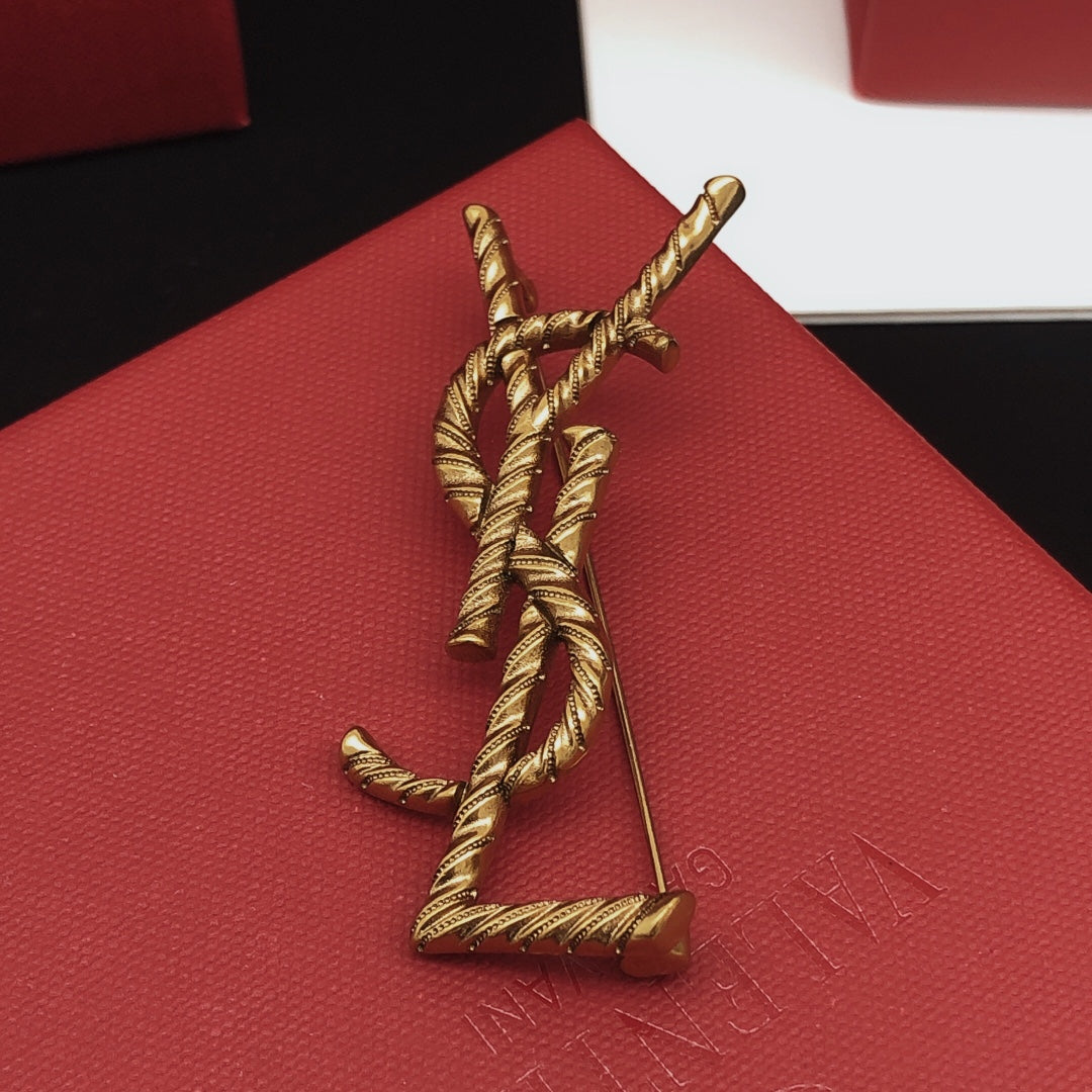 Saint Laurent Antique Gold-Tone Rope-Textured Monogram Brooch - album image 4