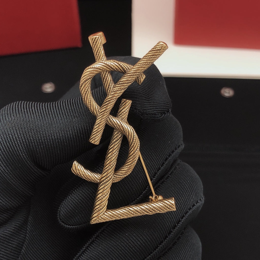 Saint Laurent Antique Gold-Tone Twisted Monogram Brooch - album image 1