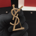 Saint Laurent Antique Gold-Tone Twisted Monogram Brooch - album image 1