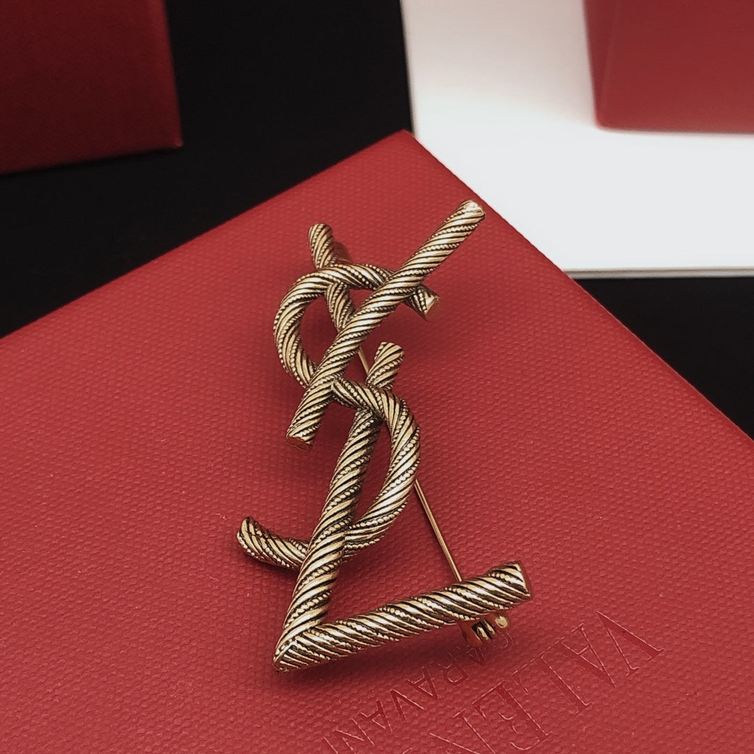 Saint Laurent Antique Gold-Tone Twisted Monogram Brooch - album image 4