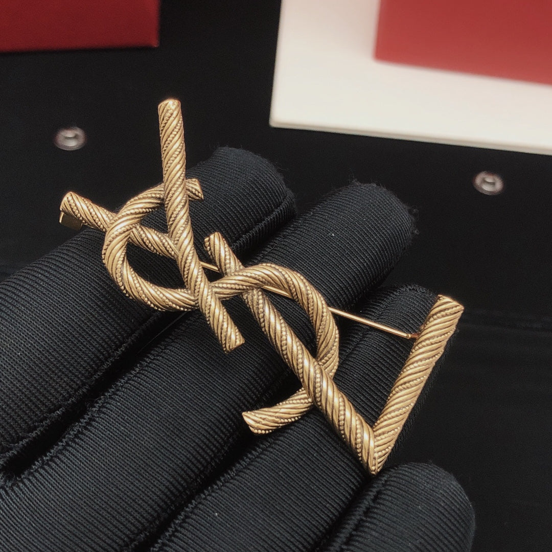Saint Laurent Antique Gold-Tone Twisted Monogram Brooch - album image 2