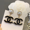 Chanel Interlocking C Black Circular Earrings - album image 1
