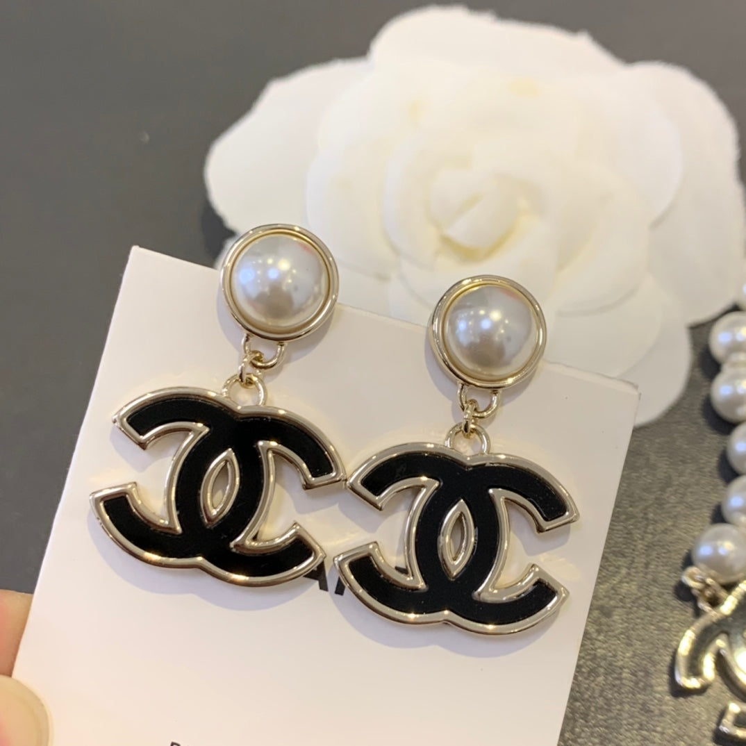 Chanel Interlocking C Black Circular Earrings - album image 1