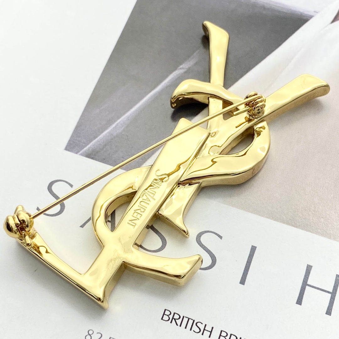 Saint Laurent Gold-Tone Sculptural Textured Monogram Brooch - album image 3