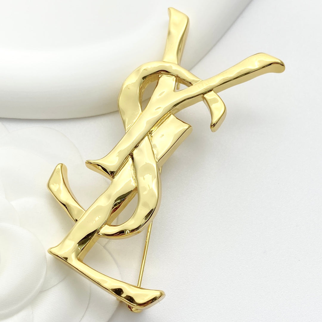 Saint Laurent Gold-Tone Sculptural Textured Monogram Brooch - album image 2