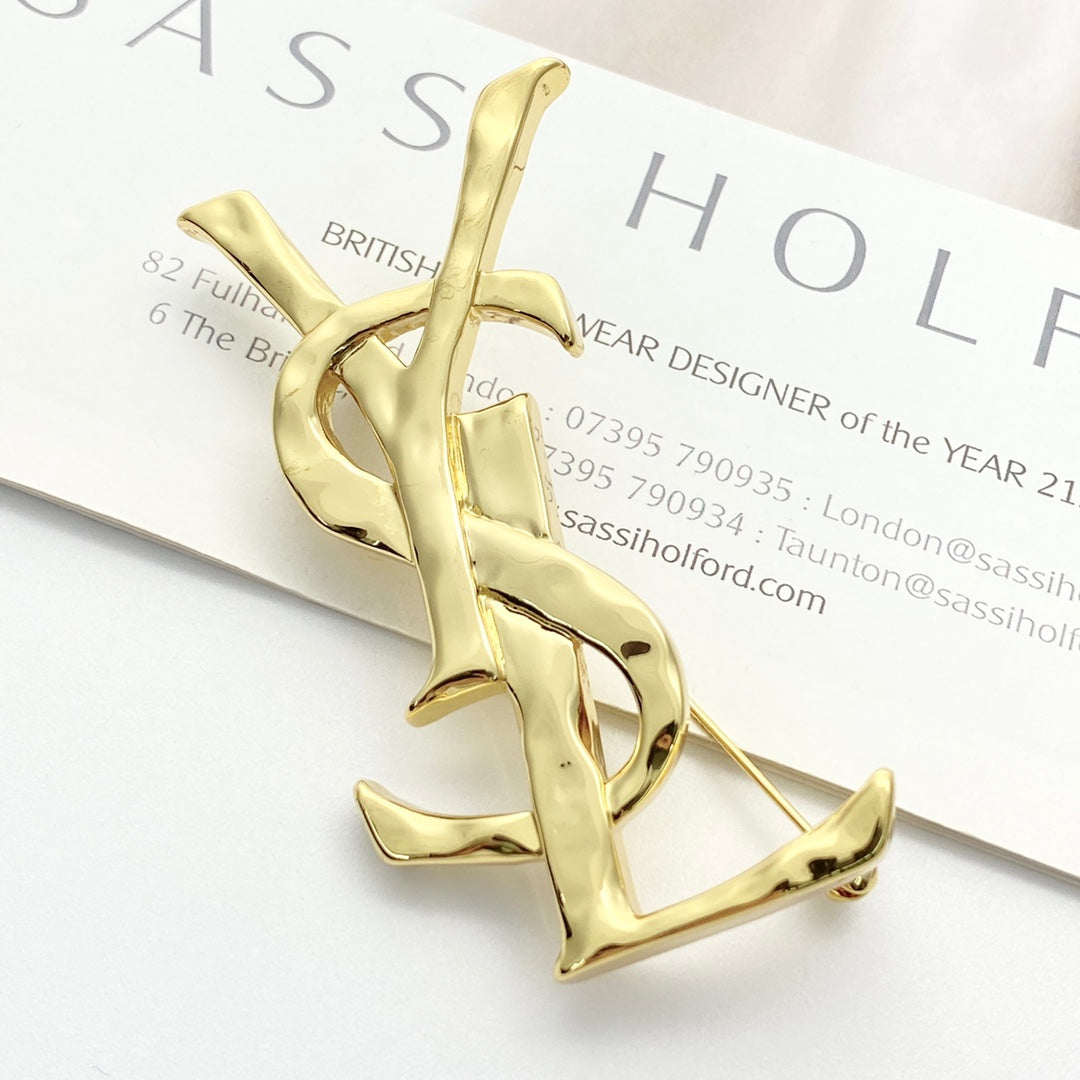 Saint Laurent Gold-Tone Sculptural Textured Monogram Brooch - album image 1