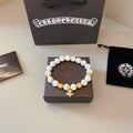 Chrome Hearts White Bead Gold Cross Bracelet - album image 1