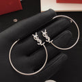 Saint Laurent Silver-Tone Monogram Oval Hoop Earrings - album image 1