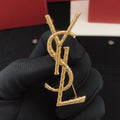 Saint Laurent Gold-Tone Twisted Monogram Brooch - album image 1