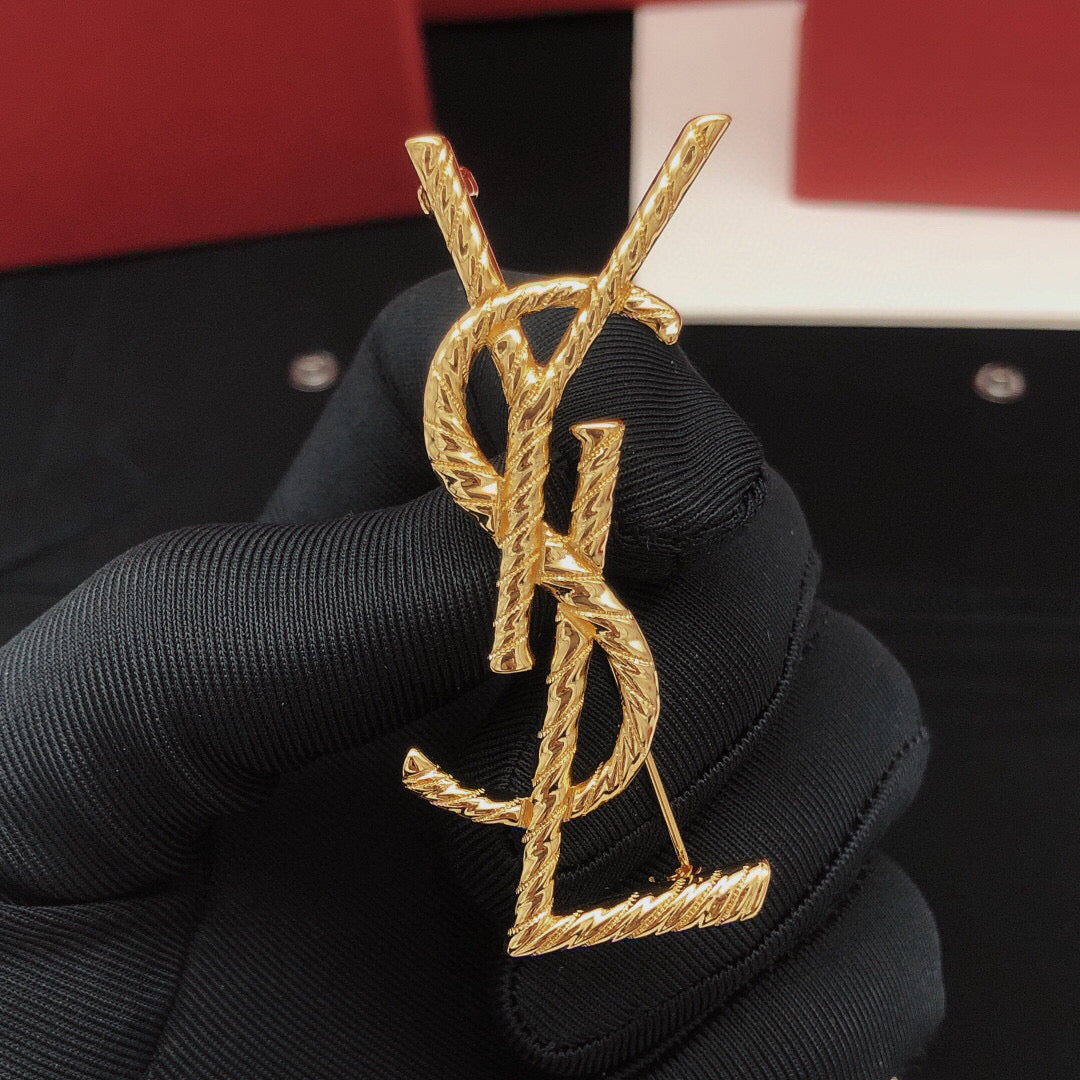 Saint Laurent Gold-Tone Twisted Monogram Brooch - album image 1