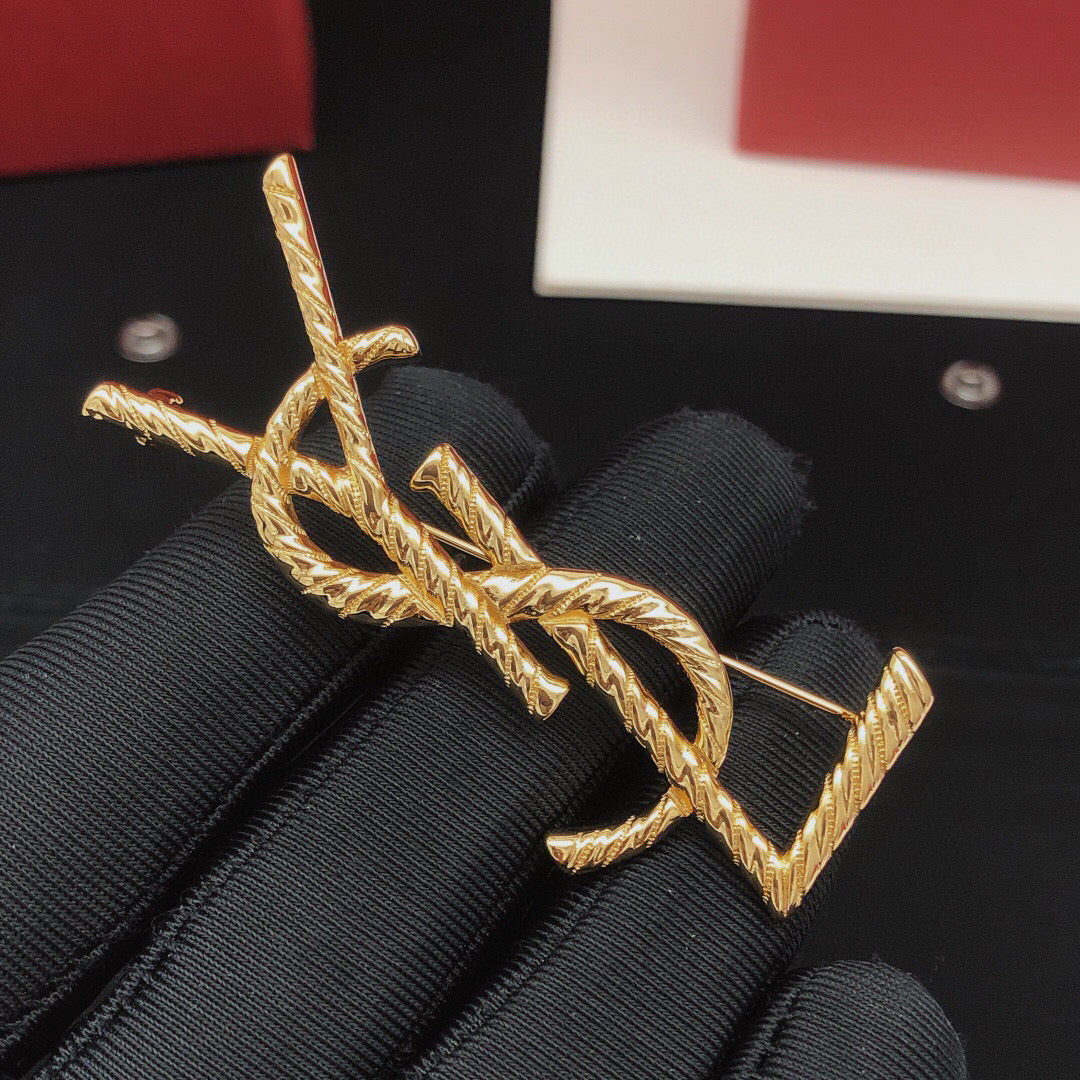 Saint Laurent Gold-Tone Twisted Monogram Brooch - album image 2