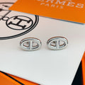 Hermès Silver-Tone Oval H Stud Earrings - album image 1
