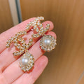 Chanel Woven Pearl Sunflower Twisted Braided Earrings - album image 1