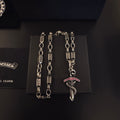 Chrome Hearts Red Accent Dagger Necklace - album image 1