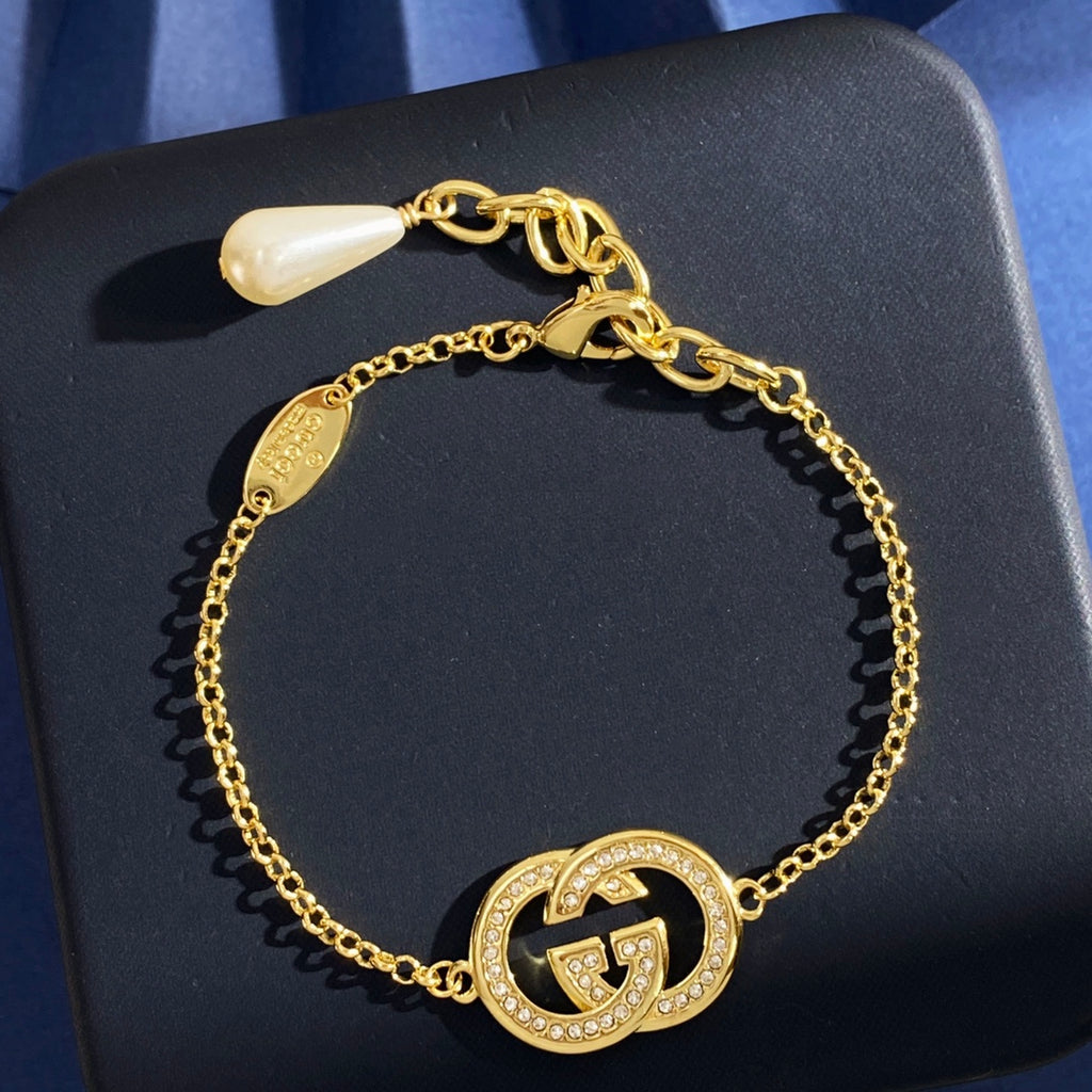 Gucci Gold-Tone Double G Charm Bracelet - album image 1
