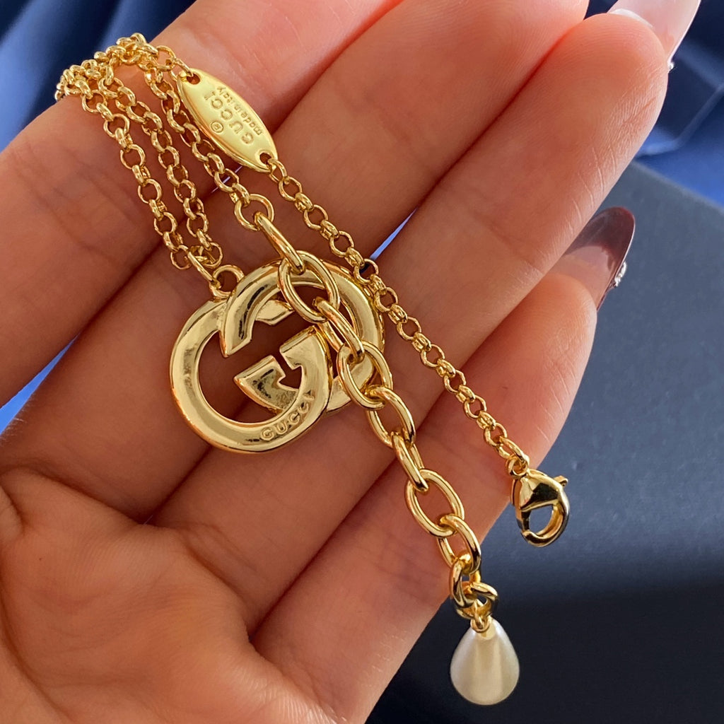 Gucci Gold-Tone Double G Drop Pendant Necklace - album image 6