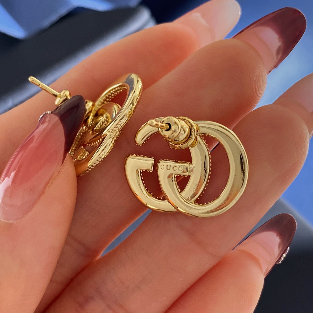 Gucci Interlocking G Gold-Tone GG Letter Stud Earrings - album image 3