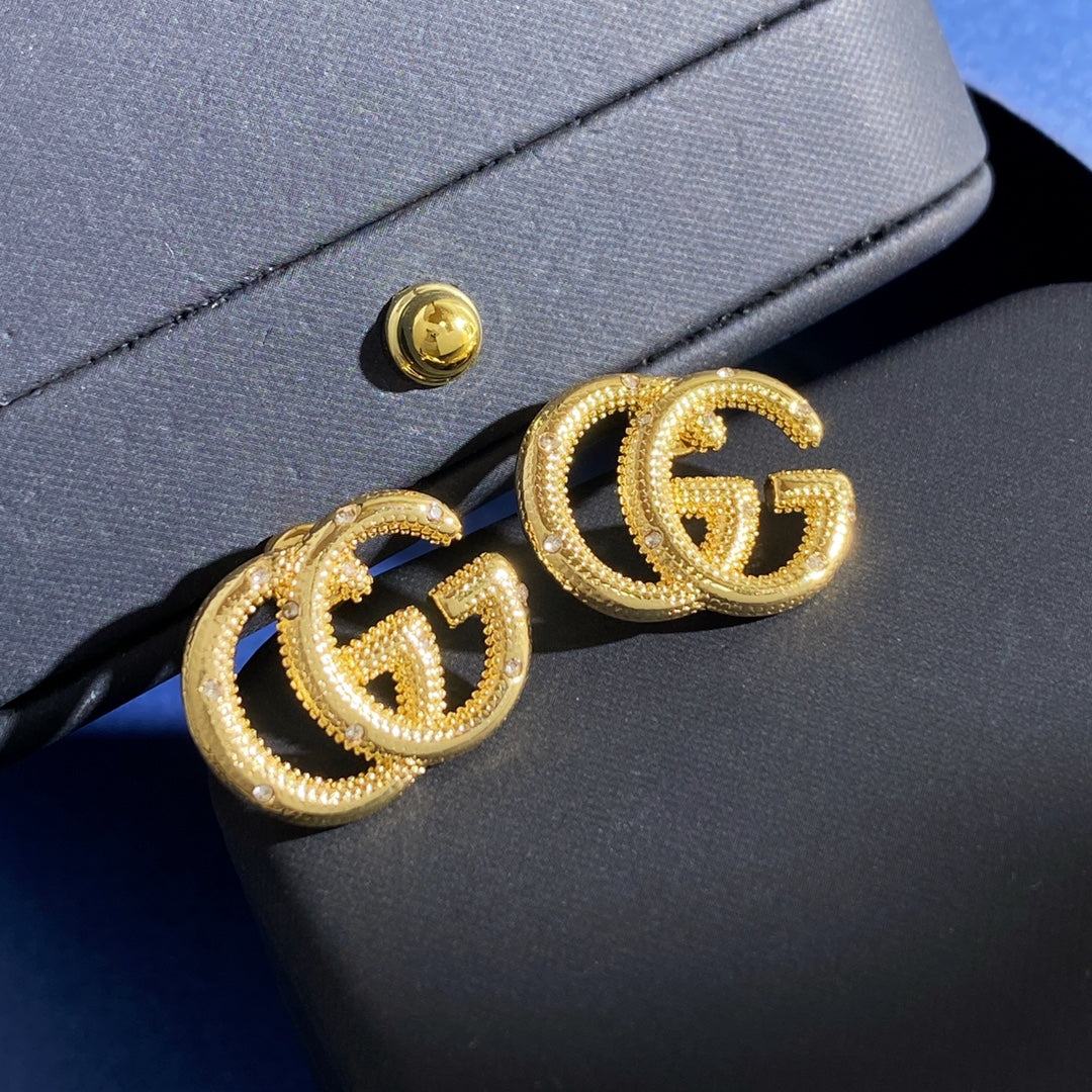 Gucci Interlocking G Gold-Tone GG Letter Stud Earrings - album image 2