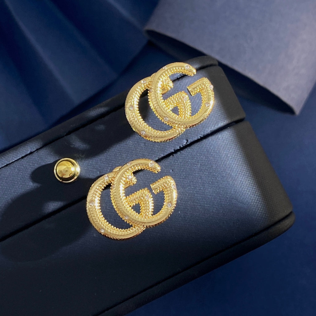 Gucci Interlocking G Gold-Tone GG Letter Stud Earrings - album image 9