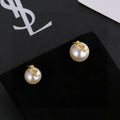 Saint Laurent Asymmetric Pearl Monogram Stud Earrings - album image 1