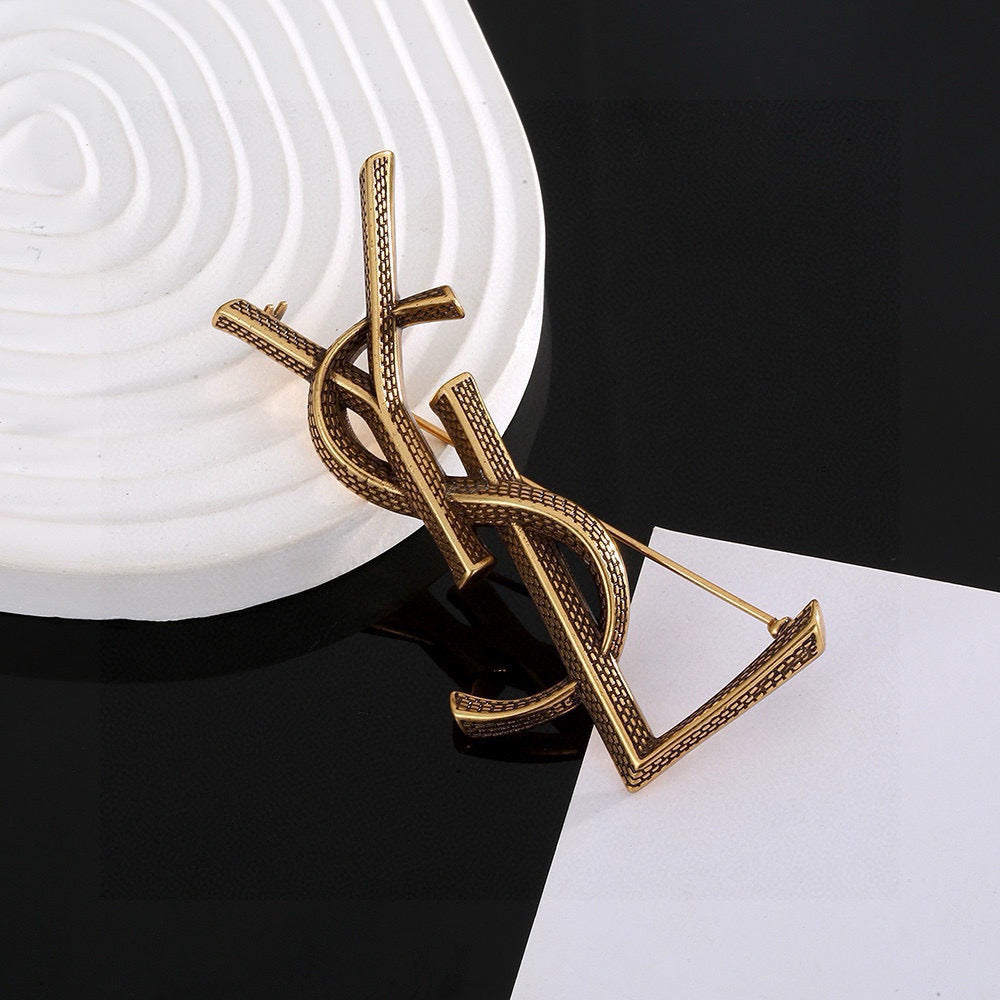 Saint Laurent Silver and Antique Gold-Tone Monogram Brooch - album image 3