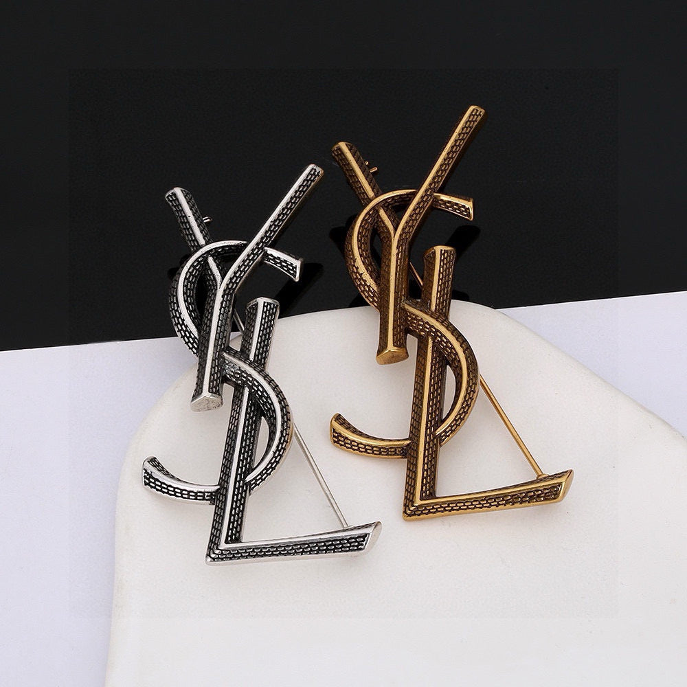 Saint Laurent Silver and Antique Gold-Tone Monogram Brooch - album image 1