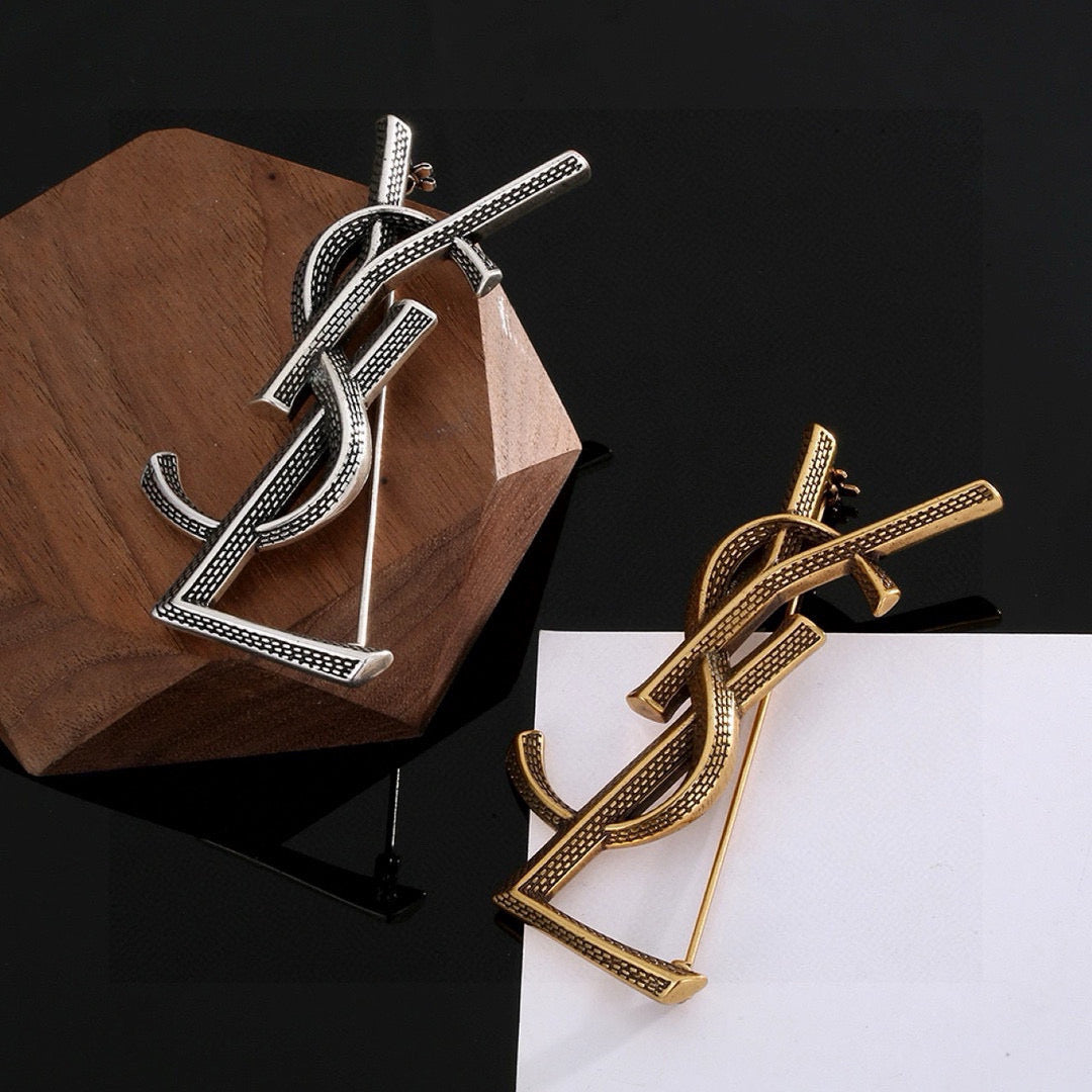 Saint Laurent Silver and Antique Gold-Tone Monogram Brooch - album image 2
