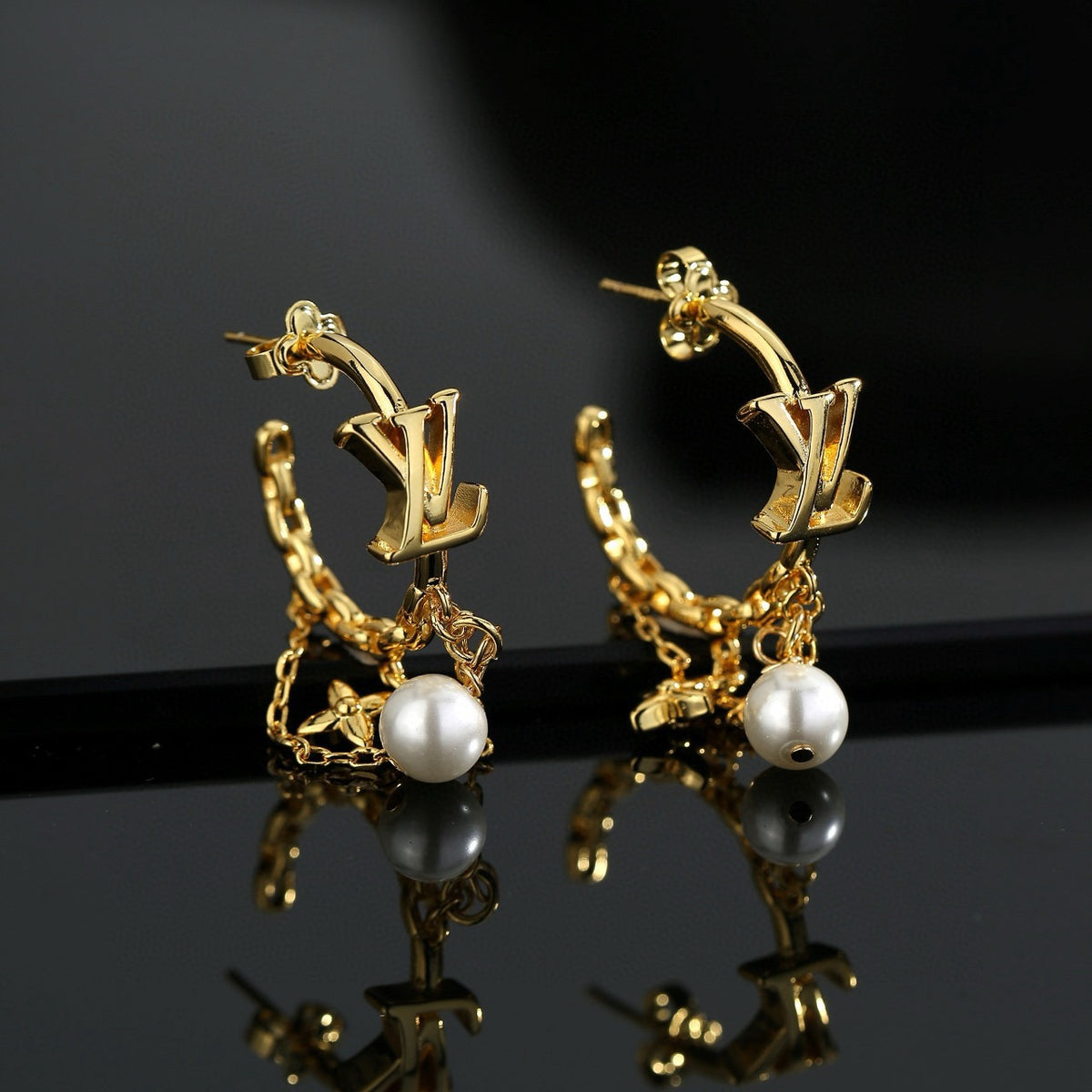Louis Vuitton LV Letter Stud Earrings - album image 1