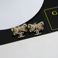 Chanel Interlocking C Bow Butterfly Earrings - album image 1