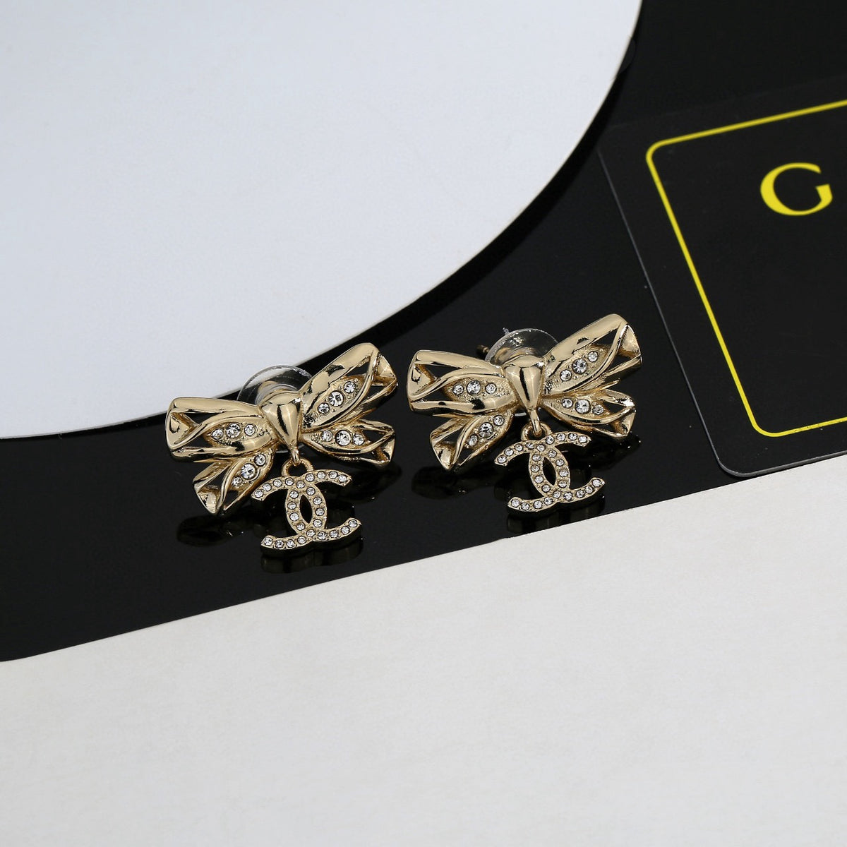 Chanel Interlocking C Bow Butterfly Earrings - album image 1