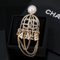 Chanel Interlocking C Letter Tassel Crystal Accent Brooch - album image 1
