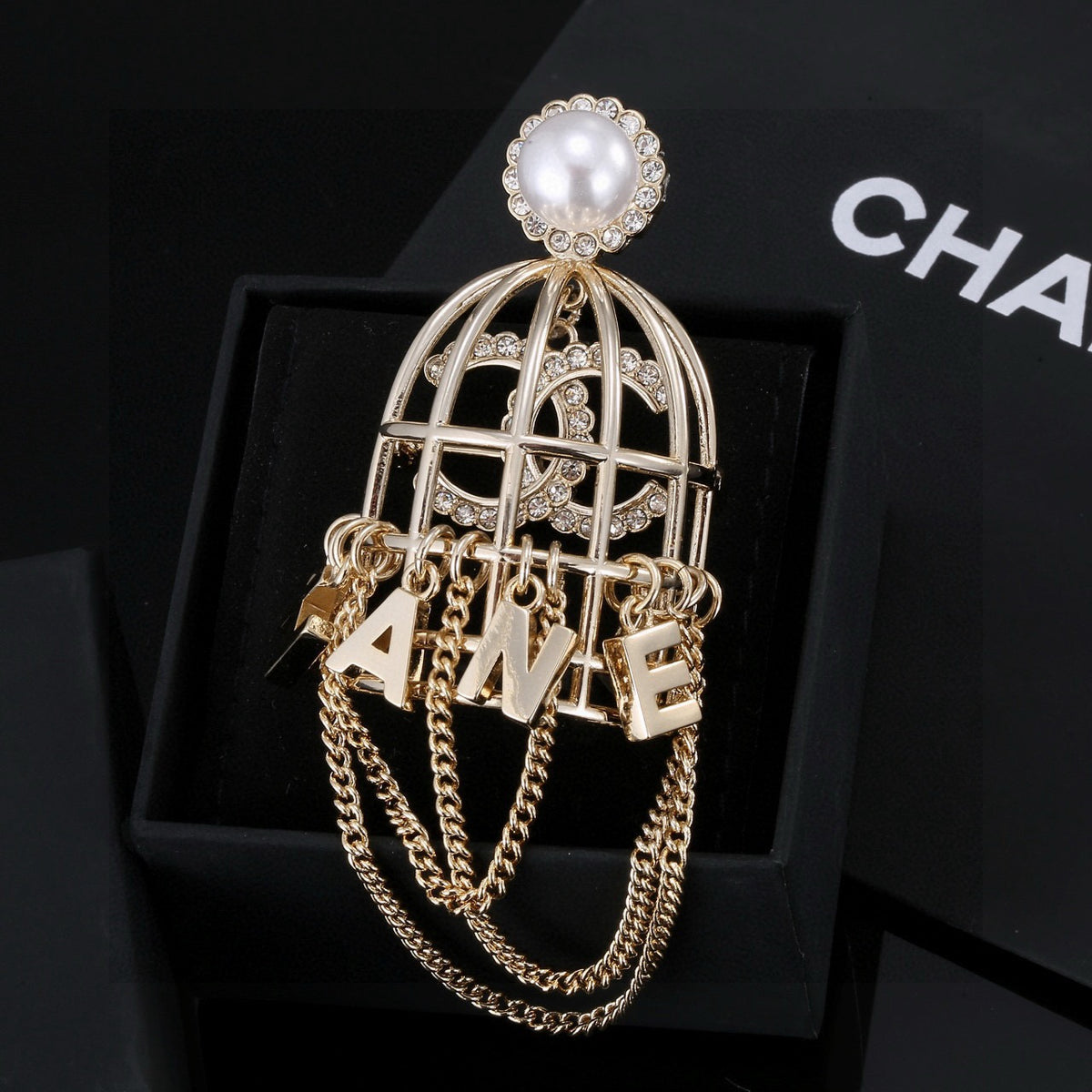 Chanel Interlocking C Letter Tassel Crystal Accent Brooch - album image 1