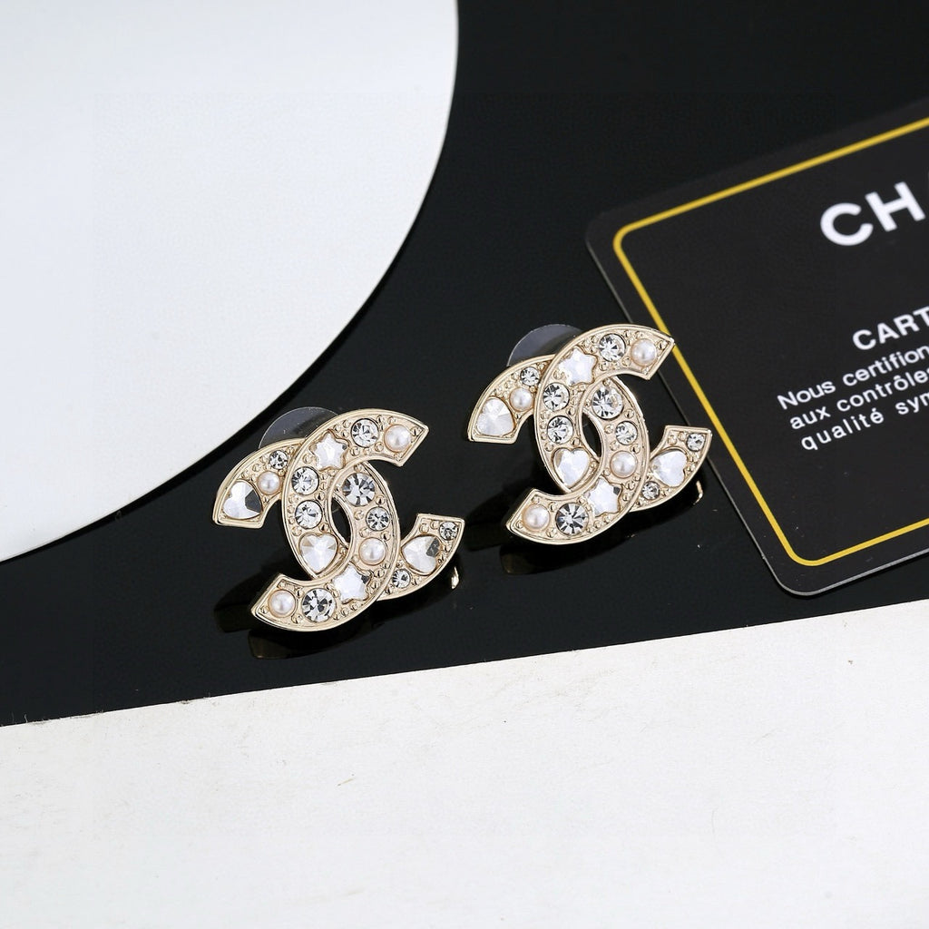 Chanel Interlocking C Gold-Tone Star Stud Earrings - album image 1