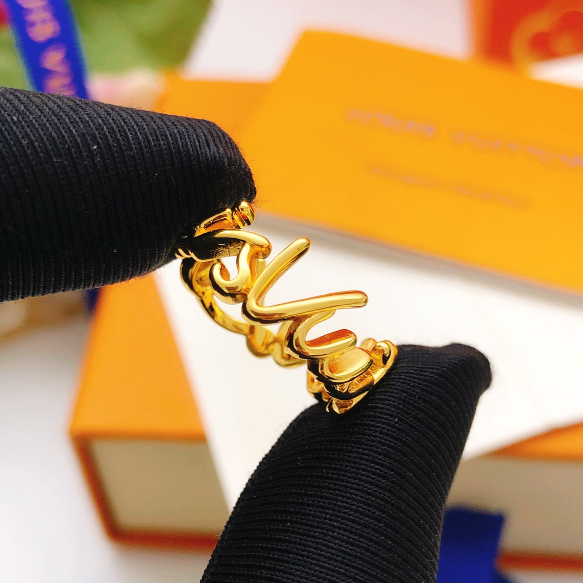 Louis Vuitton Gold-Tone Open LV Ring - album image 6