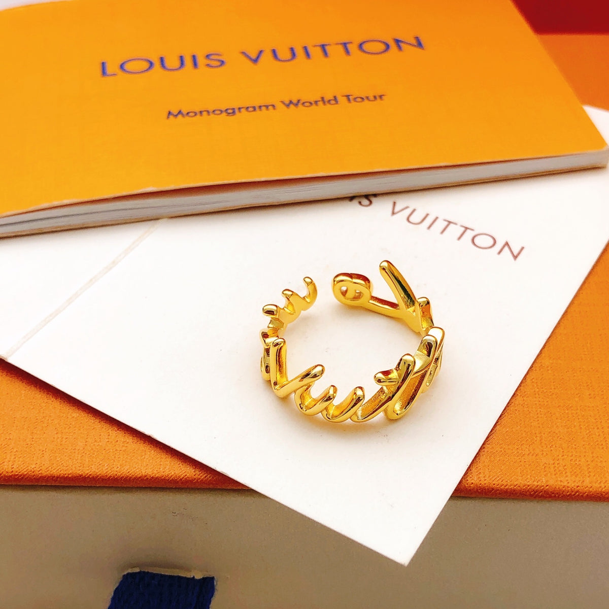 Louis Vuitton Gold-Tone Open LV Ring - album image 3