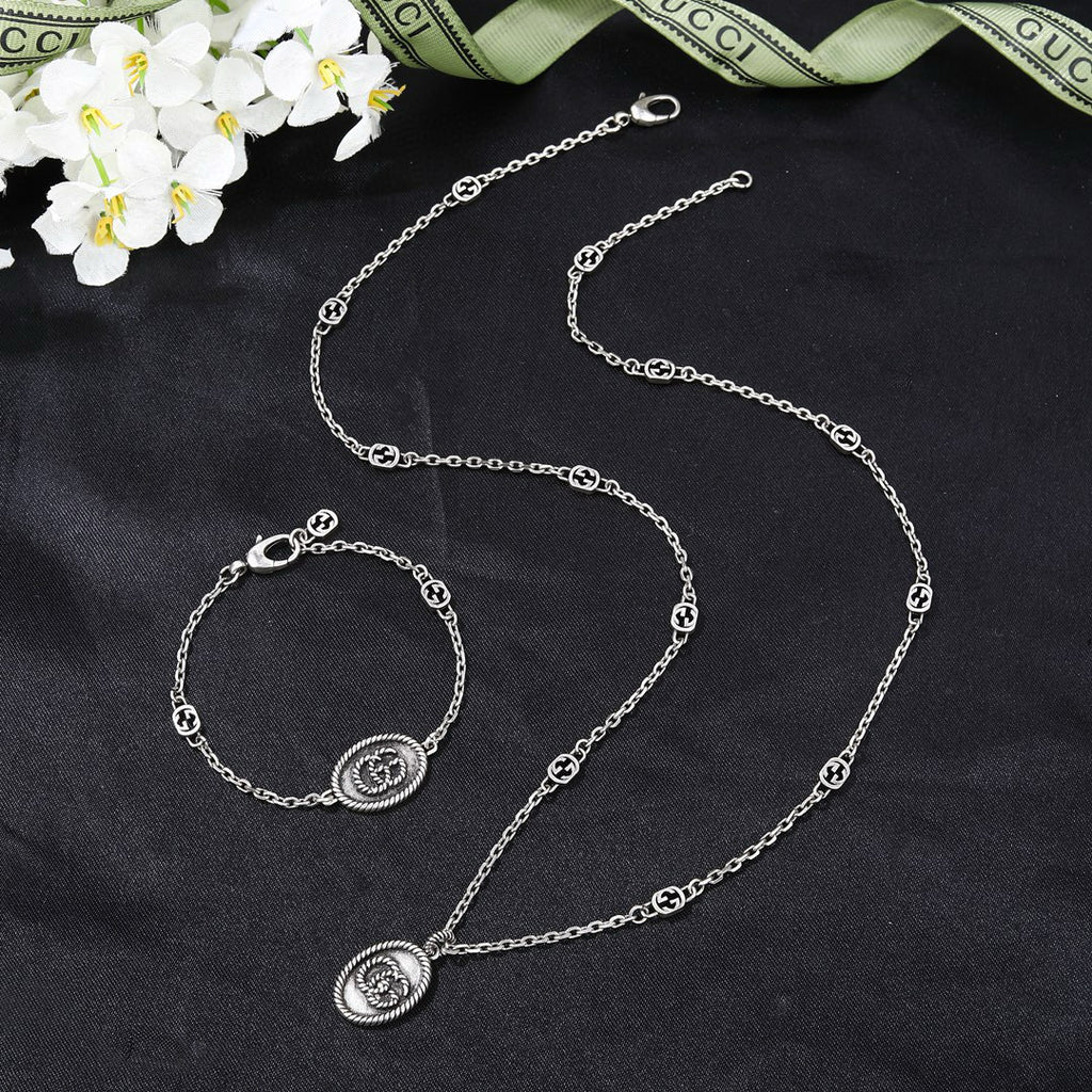 Gucci Silver-Tone Coin Charm Jewelry Options - album image 1
