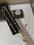 Chanel Interlocking C Gold-Tone Pearl Necklace - album image 1