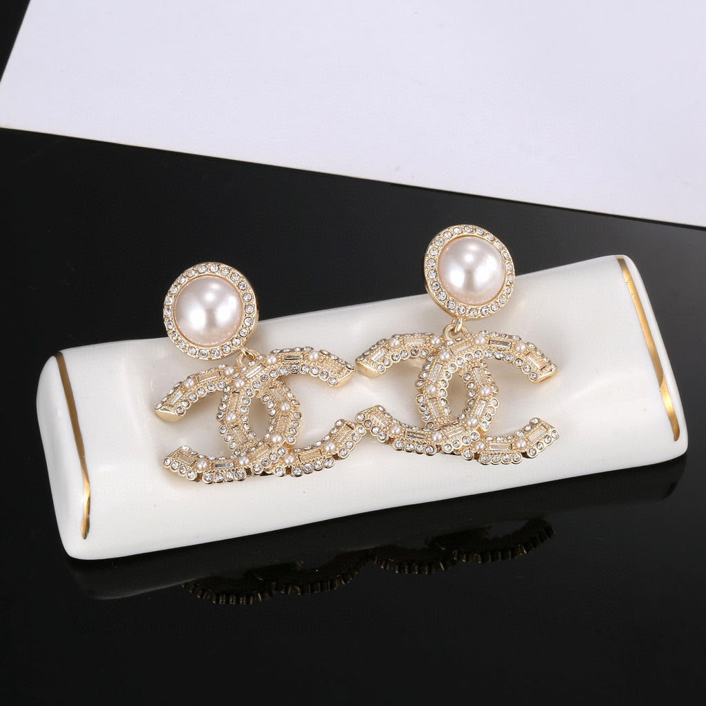 Chanel Interlocking C Gold-Tone Pearl Crystal Accent Earrings - album image 7